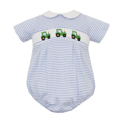Baby romper with striped pattern and embroidered tractors on a white background