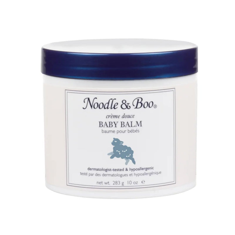 A jar of Noodle and Boo Baby Balm with a label featuring an illustration of a lamb.