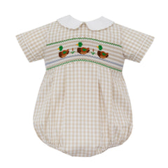 Baby romper with gingham pattern and smocked mallard duck details on a white background